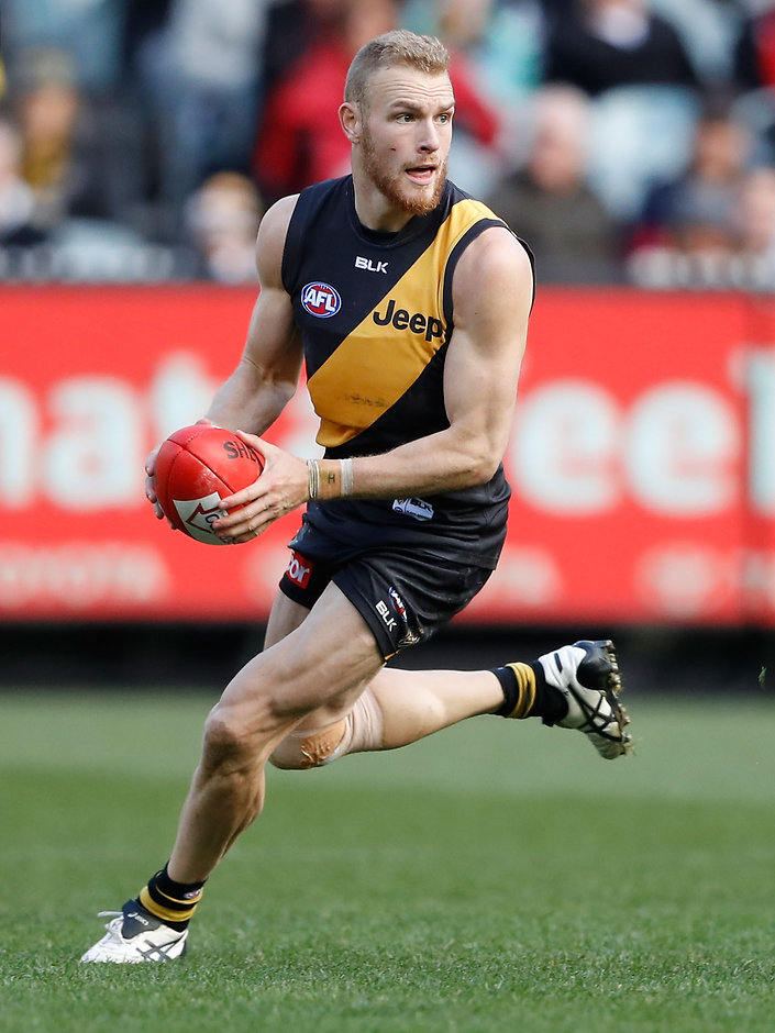 AFL 2016 Rd 22 - Richmond v St Kilda MELBOURNE, AUSTRALIA - AUGUST 20: Andrew Moore of the Tigers in action during the 2016 AFL Round 22 match between the Richmond Tigers and the St Kilda Saints at the Melbourne Cricket Ground on August 20, 2016 in Melbourne, Australia. (Photo by Adam Trafford/AFL Media)